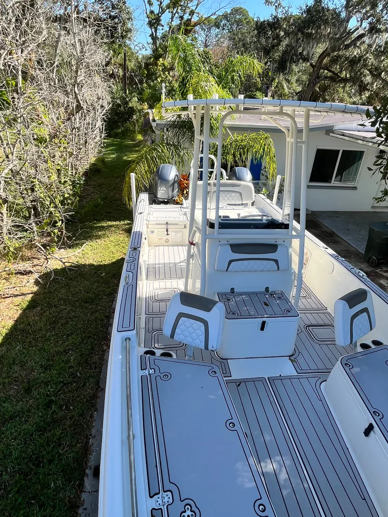 Slide: The Image of 2019 World Cat 230 CC boat parked in garden. - 27