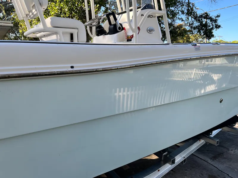 Slide: The Image of 2019 World Cat 230 CC boat side view. - 3