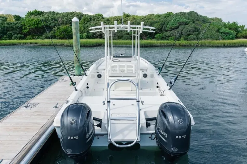 Slide: The Image of 2019 World Cat 230 CC boat docked with dual Yamaha engines. - 37