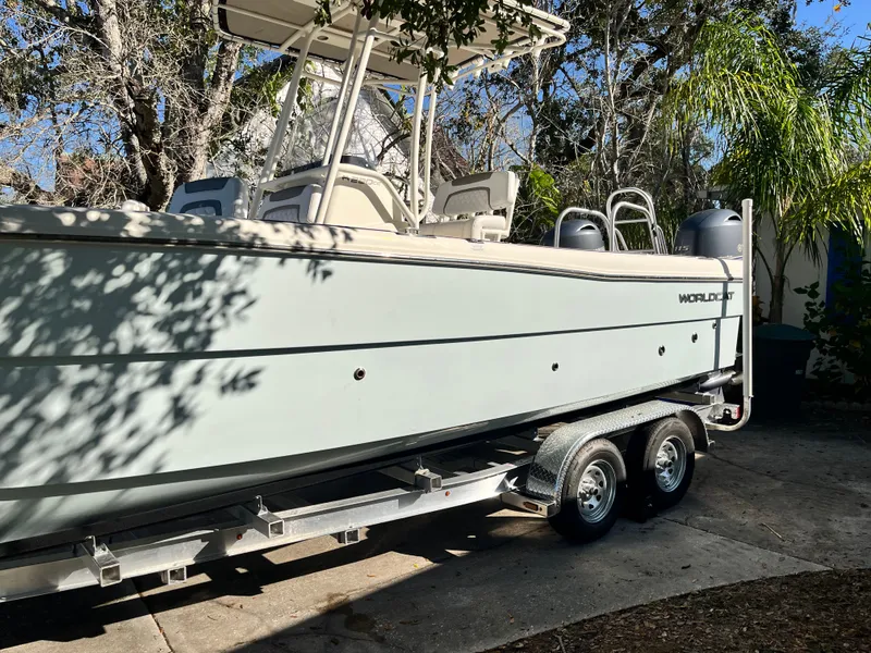 Slide: The Image of 2019 World Cat 230 CC boat on trailer outdoors. - 4