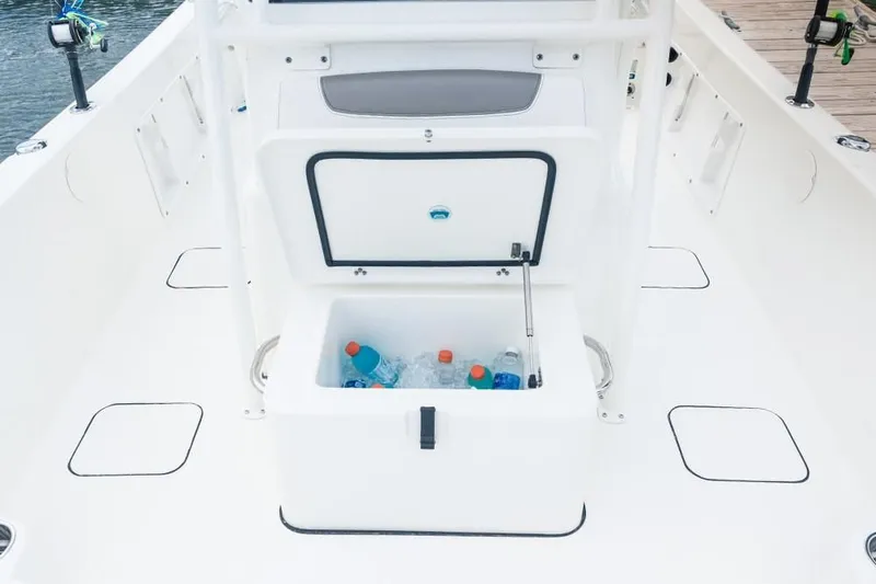Slide: The Image of Cooler on a 2019 World Cat 230 CC boat with drinks. - 41