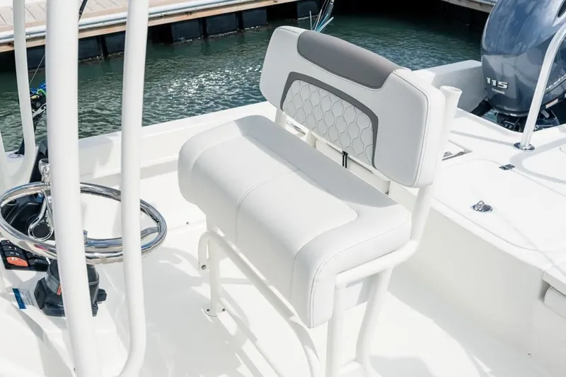 Slide: The Image of Interior of a 2019 World Cat 230 CC boat with seating and steering. - 43