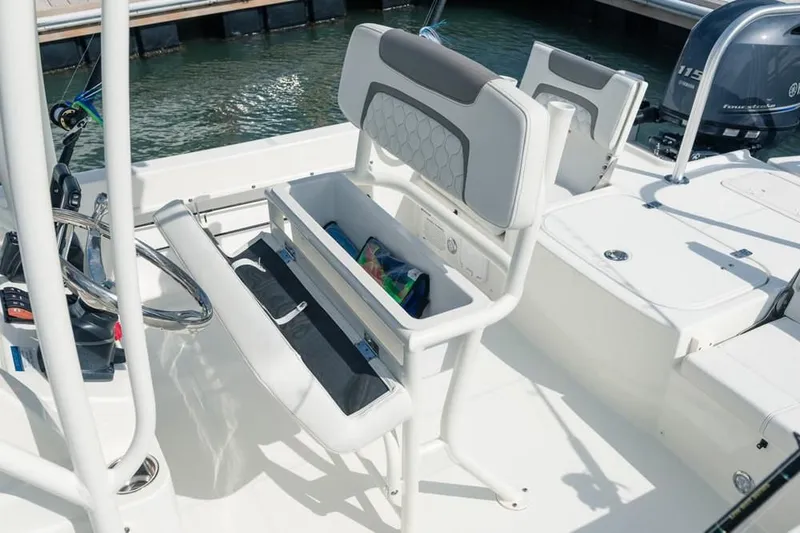 Slide: The Image of Interior of a 2019 World Cat 230 CC boat with storage compartment. - 44