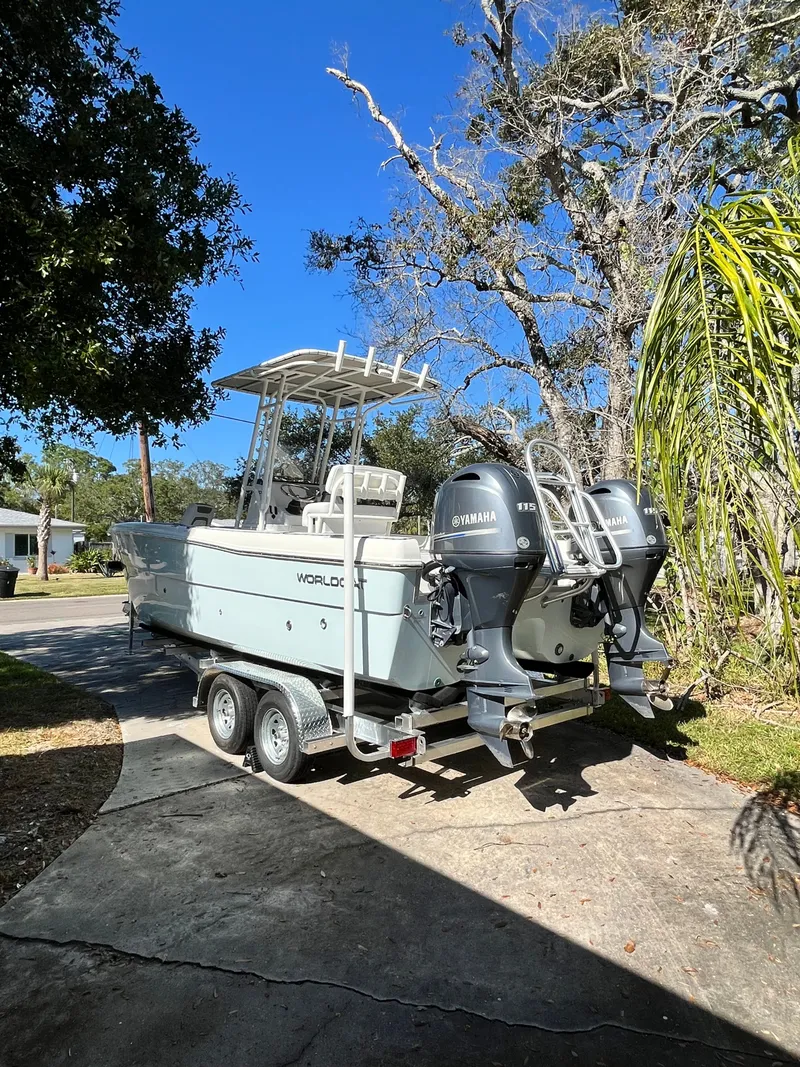 Slide: The Image of 2019 World Cat 230 CC boat on trailer outdoors. - 7
