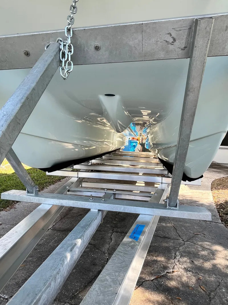 Slide: The Image of Underside of a World Cat 230 CC boat on a trailer. - 9