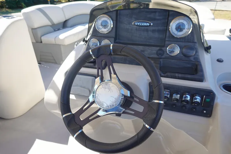 Slide: The Image of Steering wheel and dashboard of 2018 Sylvan Mirage 8522 pontoon boat. - 10