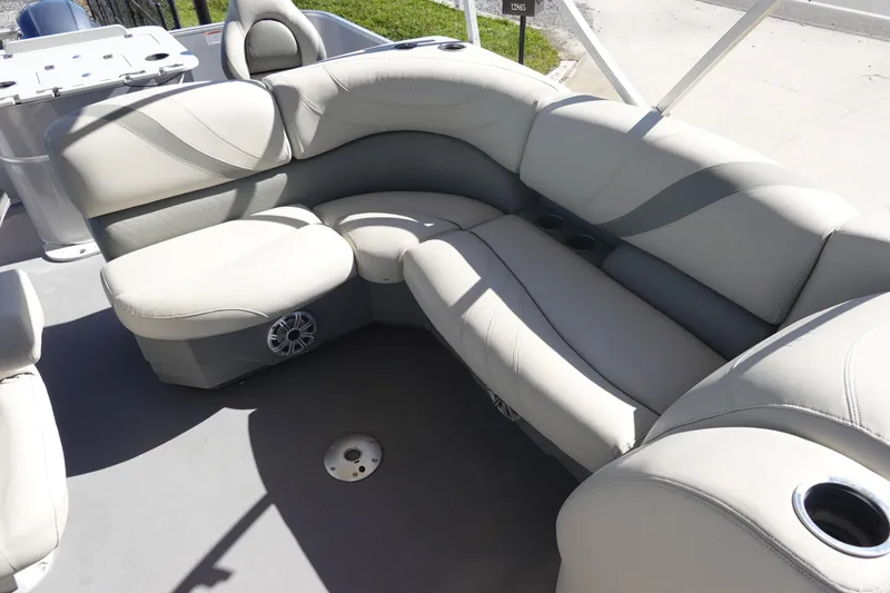Slide: The Image of 2018 Sylvan Mirage 8522 boat interior with plush seating and cup holders. - 13