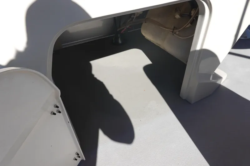 Slide: The Image of 2018 Sylvan Mirage 8522 interior compartment with open hatch and visible wiring. - 21