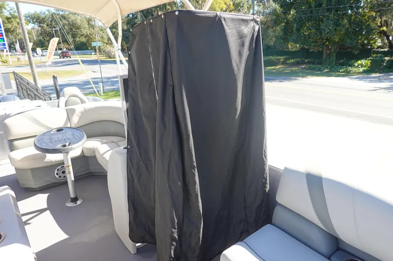 Slide: The Image of 2018 Sylvan Mirage 8522 pontoon boat interior with seating and privacy curtain. - 23