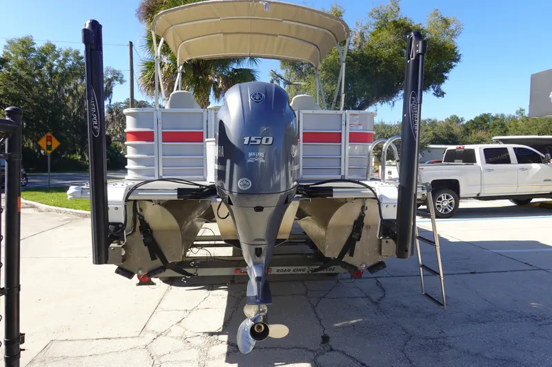 Slide: The Image of 2018 Sylvan Mirage 8522 pontoon boat with Yamaha 150 engine, parked outdoors. - 5