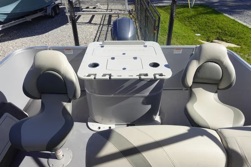Slide: The Image of 2018 Sylvan Mirage 8522 boat interior with seating and table setup. - 6