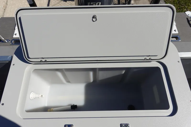 Slide: The Image of Open storage compartment on 2018 Sylvan Mirage 8522 boat, showing interior space. - 8