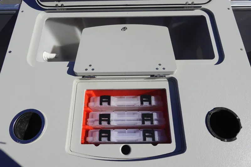 Slide: The Image of Storage compartment on 2018 Sylvan Mirage 8522 boat with organized tackle boxes. - 9