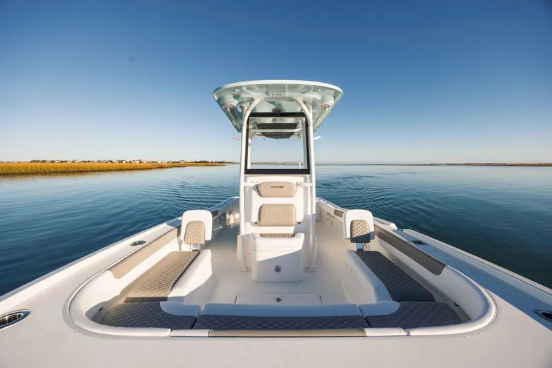 Slide: The Image of Caymas 281 HB 2026 on calm water under clear sky. - 14