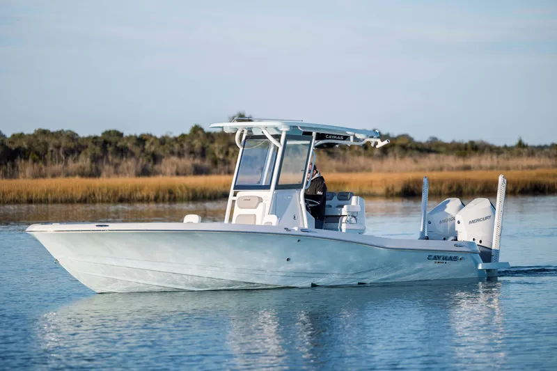 Slide: The Image of 2026 Caymas 281 HB boat on calm water. - 2