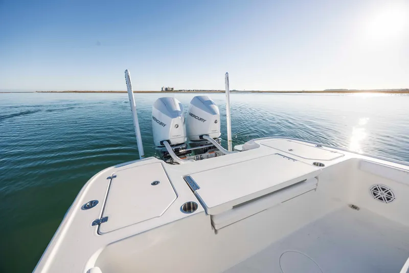 Slide: The Image of Caymas 281 HB 2026 boat with dual engines on calm water. - 23