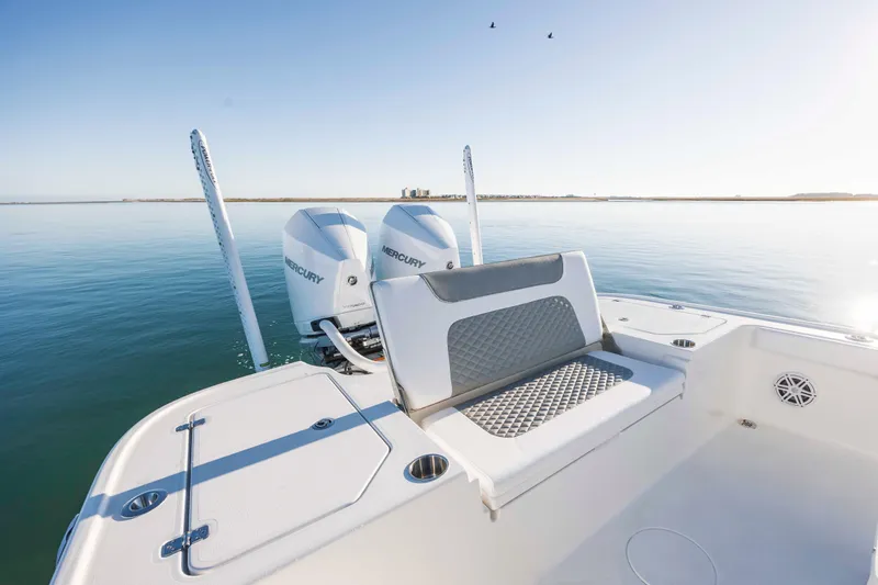 Slide: The Image of Caymas 281 HB 2026 boat with Mercury engines on calm water. - 24