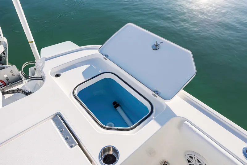 Slide: The Image of Open storage compartment on a 2026 Caymas 281 HB boat. - 26