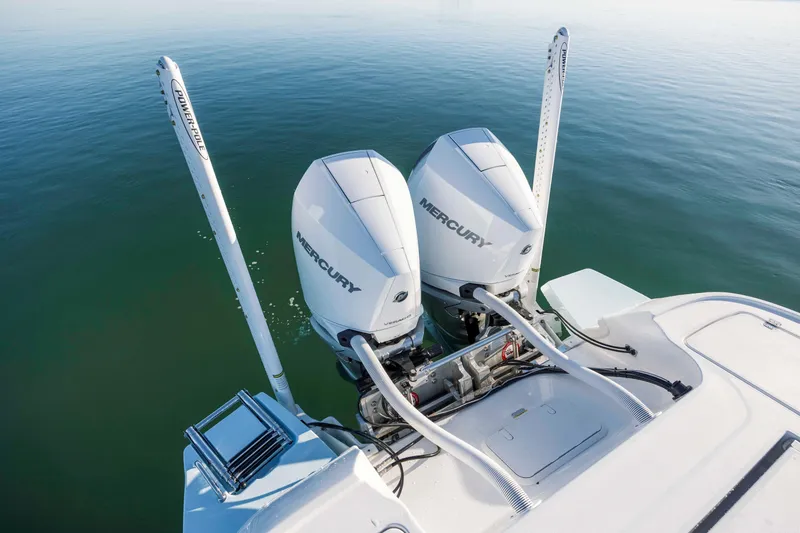 Slide: The Image of Caymas 281 HB 2026 with Mercury engines on calm water. - 28