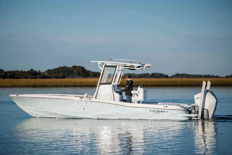 Slide: The Image of 2026 Caymas 281 HB boat on calm water. - 4