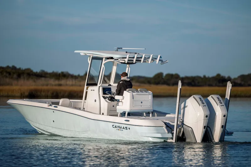 Slide: The Image of 2026 Caymas 281 HB boat on calm water. - 5