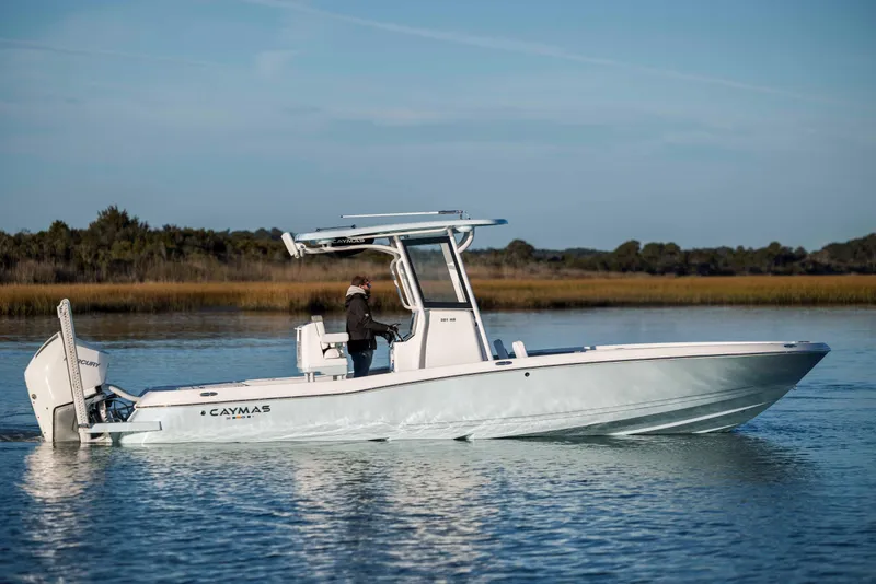 Slide: The Image of 2026 Caymas 281 HB boat on calm water. - 8