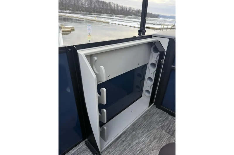 Slide: The Image of 2026 Bentley Pontoons 200 Fish-N-Cruise interior storage compartment with rod holders. - 10