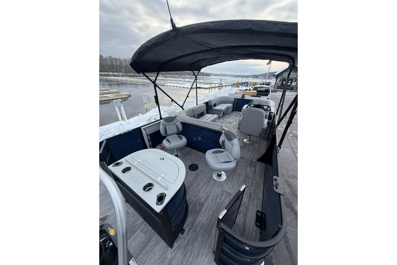 Slide: The Image of 2026 Bentley Pontoons 200 Fish-N-Cruise with spacious seating and sleek design on a snowy dock. - 12