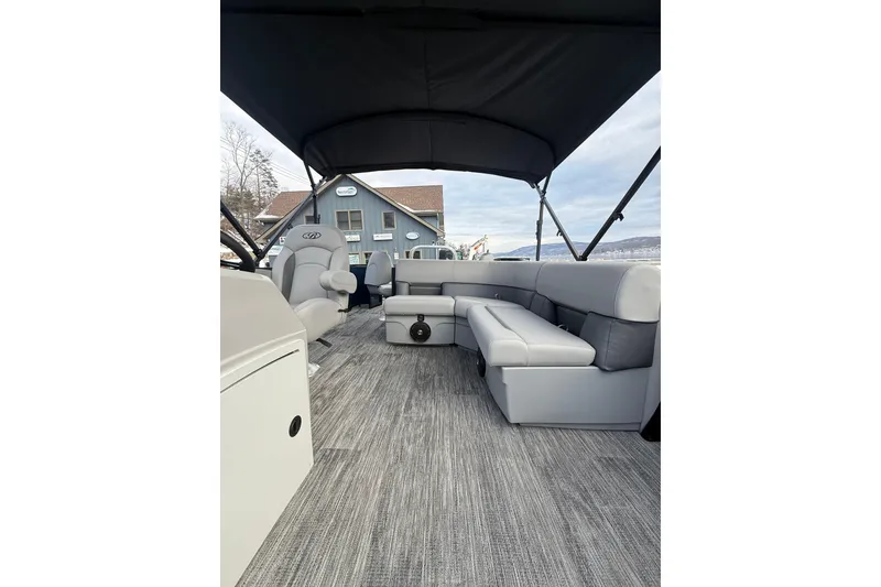 Slide: The Image of 2026 Bentley Pontoons 200 Fish-N-Cruise interior with gray seating and canopy. - 13