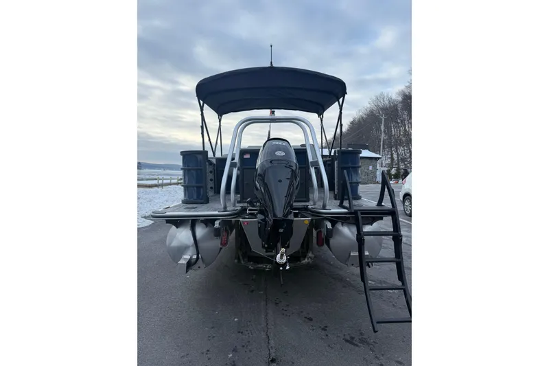 Slide: The Image of 2026 Bentley Pontoons 200 Fish-N-Cruise on snowy lakeside, rear view with canopy. - 4