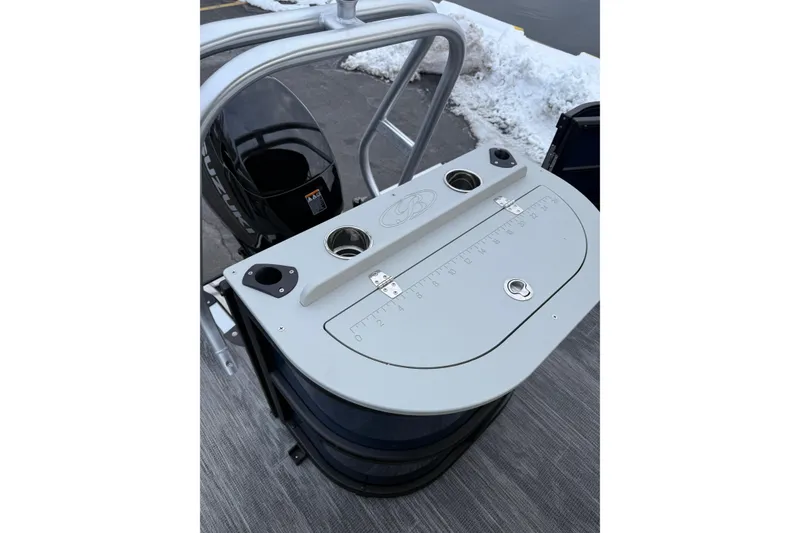 Slide: The Image of 2026 Bentley Pontoons 200 Fish-N-Cruise boat with Suzuki outboard motor, snowy background. - 8