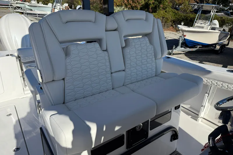 Slide: The Image of 2026 Tidewater 302 CC Adventure boat with luxurious white seating and modern design. - 16