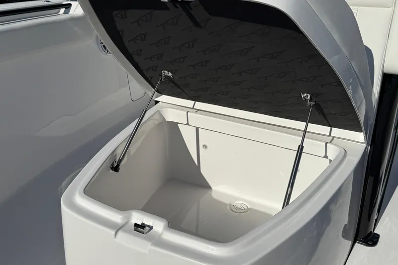 Slide: The Image of Open storage compartment on 2026 Tidewater 302 CC Adventure boat. - 17