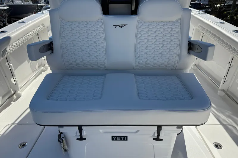 Slide: The Image of 2026 Tidewater 302 CC Adventure boat seat with Yeti cooler underneath. - 19