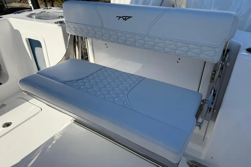 Slide: The Image of 2026 Tidewater 302 CC Adventure boat seat with stylish blue upholstery. - 20