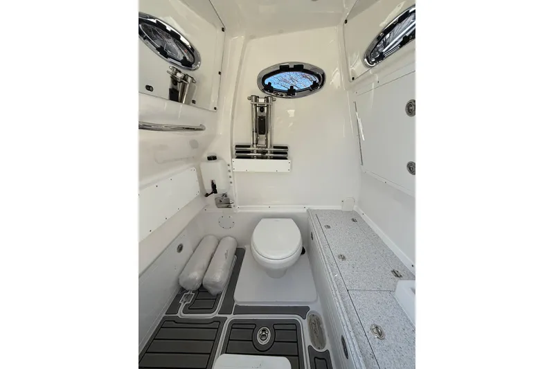 Slide: The Image of 2026 Tidewater 302 CC Adventure boat interior with modern bathroom amenities. - 27