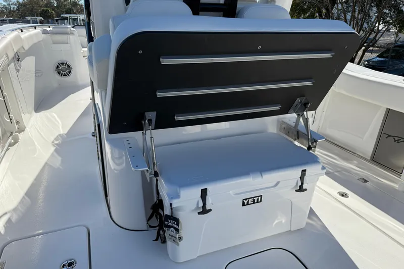 Slide: The Image of 2026 Tidewater 302 CC Adventure boat with Yeti cooler on deck. - 29