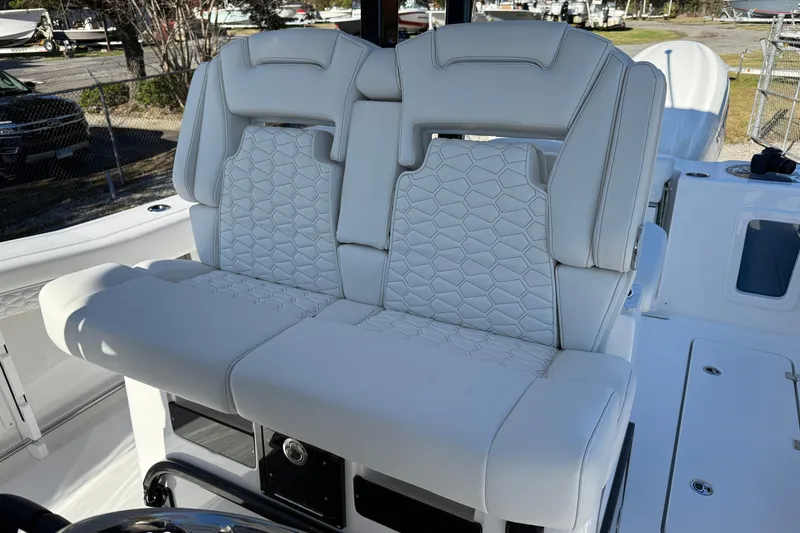 Slide: The Image of 2026 Tidewater 302 CC Adventure boat with luxurious white seating. - 5