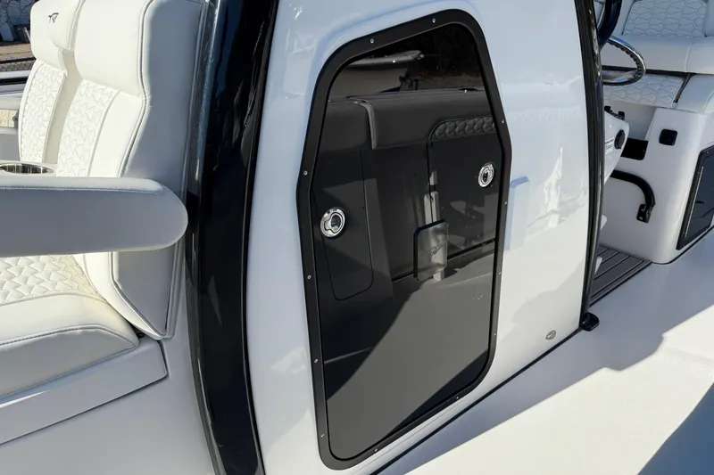 Slide: The Image of 2026 Tidewater 302 CC Adventure boat interior with sleek seating and modern design. - 7