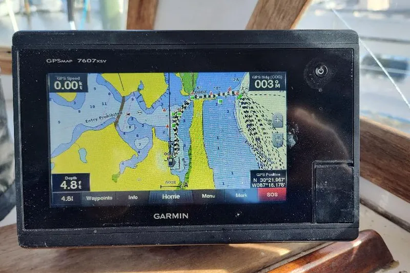 Slide: The Image of Garmin GPS display on 1987 Albin Family Cruiser, showing nautical map and navigation details. - 12