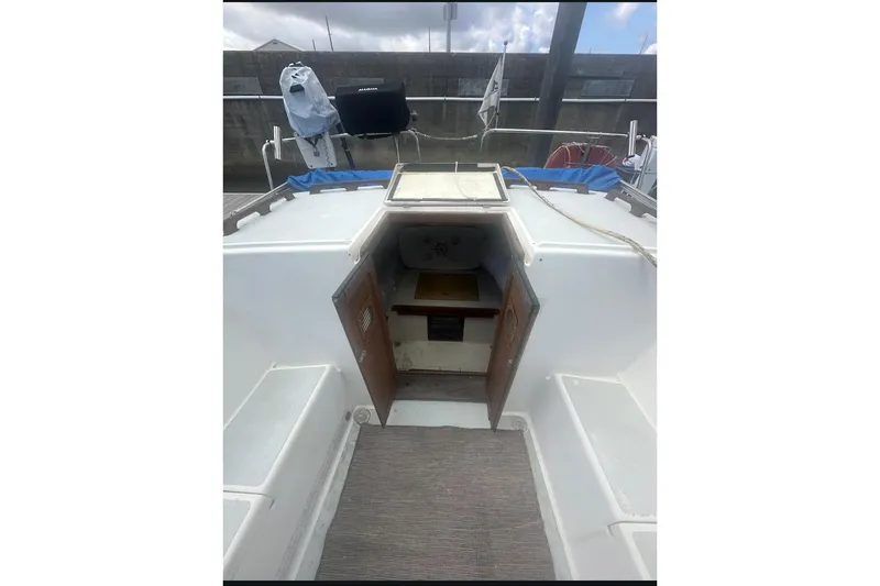 Slide: The Image of 1987 Albin Family Cruiser interior view with open cabin door. - 28