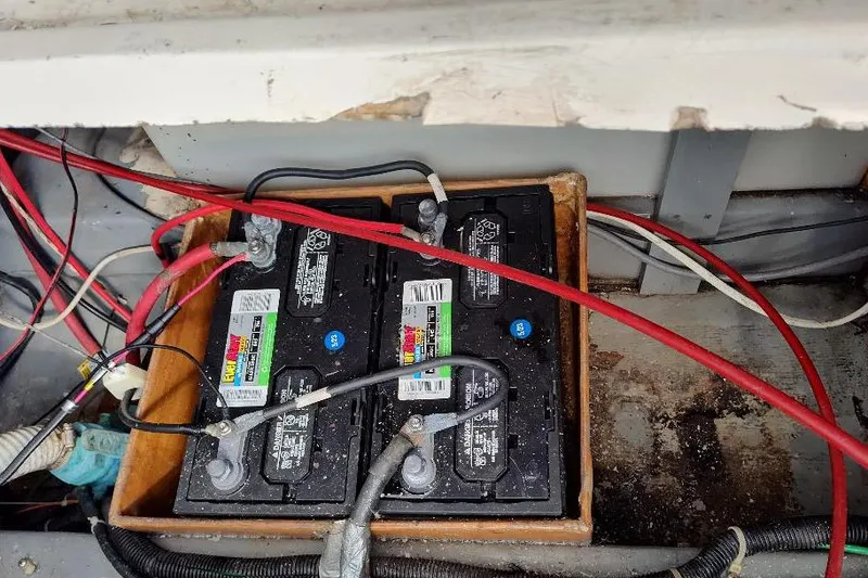 Slide: The Image of Two marine batteries in a 1987 Albin Family Cruiser boat. - 32