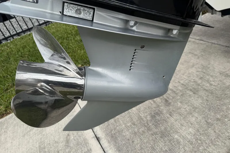 Slide: The Image of 2017 Mako Pro Skiff 19 CC boat propeller on concrete surface. - 10