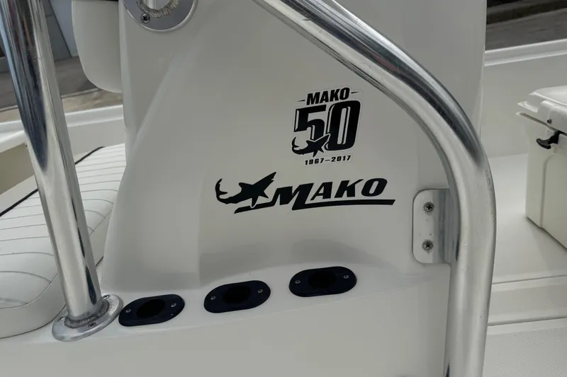 Slide: The Image of 2017 Mako Pro Skiff 19 CC boat interior with logo and anniversary decal. - 19