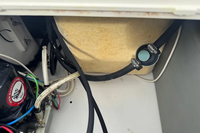 Slide: The Image of 2017 Mako Pro Skiff 19 CC interior wiring and components close-up. - 34