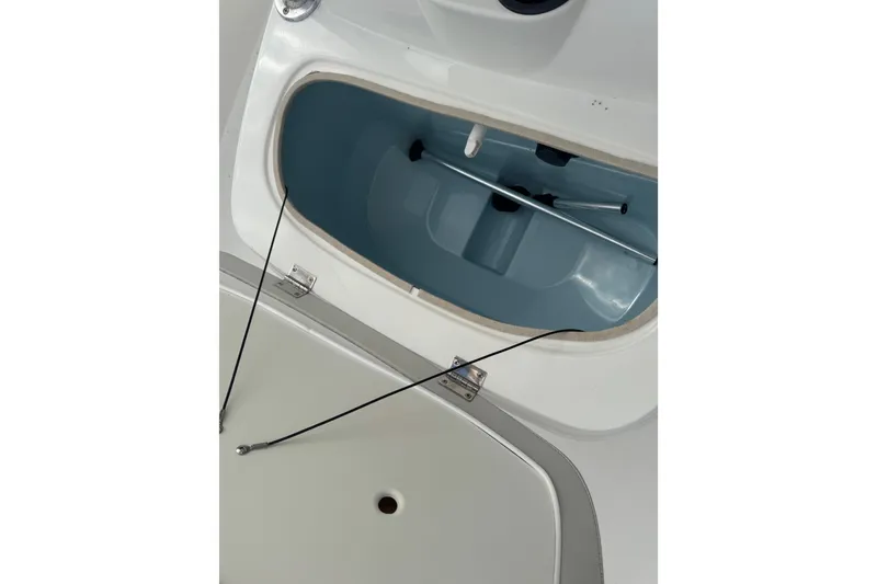Slide: The Image of Open storage compartment on 2017 Mako Pro Skiff 19 CC boat. - 46