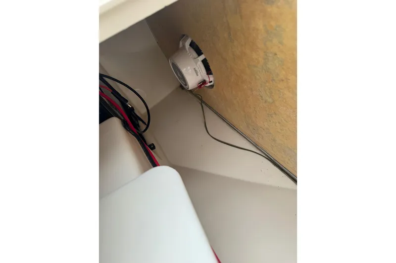 Slide: The Image of Interior view of a 2017 Mako Pro Skiff 19 CC boat with wiring and speaker. - 50