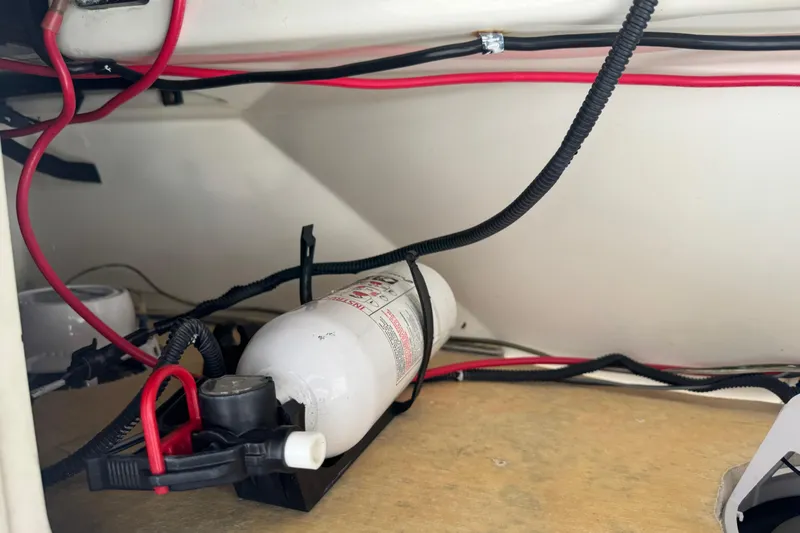 Slide: The Image of 2017 Mako Pro Skiff 19 CC interior wiring and fire extinguisher setup. - 51