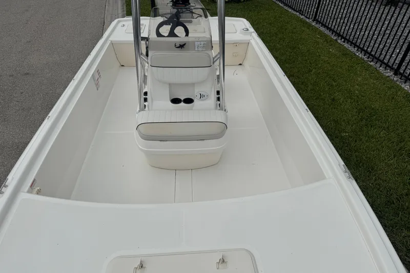 Slide: The Image of 2017 Mako Pro Skiff 19 CC boat interior with center console and seating. - 53