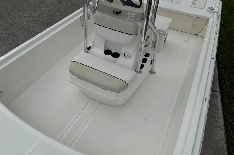 Slide: The Image of 2017 Mako Pro Skiff 19 CC boat interior with seating and console. - 55